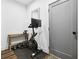 Exercise room equipped with an indoor cycling bike and free weights at 24 Becker Nw Pl, Atlanta, GA 30307