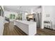 Bright kitchen with a large center island, stainless steel appliances, and modern fixtures at 24 Becker Nw Pl, Atlanta, GA 30307