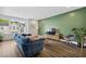 Comfortable living room with large windows, hardwood floors, and stylish furniture at 24 Becker Nw Pl, Atlanta, GA 30307