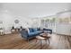 Bright living room with hardwood floors, a large window, and stylish furniture at 24 Becker Nw Pl, Atlanta, GA 30307