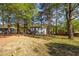 Secluded home surrounded by mature trees and a spacious yard, perfect for outdoor activities at 2531 Ridgecrest Nw Dr, Kennesaw, GA 30152