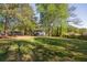 Expansive green backyard with mature trees provides a serene and private outdoor space at 2531 Ridgecrest Nw Dr, Kennesaw, GA 30152