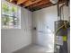 Unfinished basement shows water heater and small window at 2531 Ridgecrest Nw Dr, Kennesaw, GA 30152