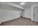 Basement is finished with laminate floors and painted white walls at 2531 Ridgecrest Nw Dr, Kennesaw, GA 30152