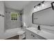 Bright bathroom features modern fixtures, granite-look tile, and a sleek, frameless mirror at 2531 Ridgecrest Nw Dr, Kennesaw, GA 30152