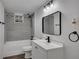 Bright bathroom features modern fixtures, granite-look tile, and a sleek, frameless mirror at 2531 Ridgecrest Nw Dr, Kennesaw, GA 30152