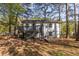 Charming home with a deck nestled in a wooded lot offering privacy and outdoor living at 2531 Ridgecrest Nw Dr, Kennesaw, GA 30152