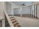An open view of the upstairs hallway shows hardwood floors and black iron railing at 2531 Ridgecrest Nw Dr, Kennesaw, GA 30152