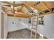 Unfinished space with open roof, ladder to loft, and wood flooring presents a customizable area at 2531 Ridgecrest Nw Dr, Kennesaw, GA 30152