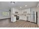 Spacious kitchen with updated stainless appliances, bright white cabinets, and hardwood flooring at 2531 Ridgecrest Nw Dr, Kennesaw, GA 30152