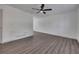 A bright living room showcases new hardwood floors, fresh paint, and a modern ceiling fan at 2531 Ridgecrest Nw Dr, Kennesaw, GA 30152