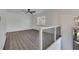 A view from the hallway shows the light-filled living room with hardwood floors and a modern ceiling fan at 2531 Ridgecrest Nw Dr, Kennesaw, GA 30152