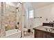 Bathroom with tile shower, dark granite counters, and a modern sink at 4140 Hillside Nw Pl, Atlanta, GA 30342
