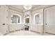 Elegant bathroom features dual vanities, marble counters, and a decorative chandelier at 4140 Hillside Nw Pl, Atlanta, GA 30342