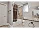 Well-lit bathroom with a shower-tub combo and a granite topped vanity with double sinks at 4140 Hillside Nw Pl, Atlanta, GA 30342