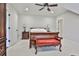 Bedroom featuring a vintage sleigh bed and ample natural light at 4140 Hillside Nw Pl, Atlanta, GA 30342
