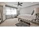 Comfortable bedroom featuring carpet, natural light, and a decorative armoire at 4140 Hillside Nw Pl, Atlanta, GA 30342