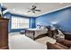 Blue bedroom with natural light, comfortable furnishings and office space at 4140 Hillside Nw Pl, Atlanta, GA 30342