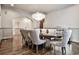 Refined dining area with hardwood floors, a crystal chandelier, and neutral tones at 4140 Hillside Nw Pl, Atlanta, GA 30342
