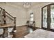 Elegant foyer featuring dark wood floors, ornate doors, and decorative lighting at 4140 Hillside Nw Pl, Atlanta, GA 30342