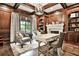 Elegant home office with custom wood paneling, built-in bookshelves, and a fireplace at 4140 Hillside Nw Pl, Atlanta, GA 30342