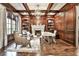 Inviting home office featuring a fireplace, built-in bookcases, and ample natural light at 4140 Hillside Nw Pl, Atlanta, GA 30342