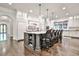 Stunning kitchen island with seating, ample storage, and elegant pendant lighting at 4140 Hillside Nw Pl, Atlanta, GA 30342