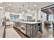 Gourmet kitchen featuring an island with seating and modern appliances at 4140 Hillside Nw Pl, Atlanta, GA 30342