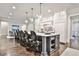 Spacious open concept kitchen with a large island, pendant lighting, and stainless appliances at 4140 Hillside Nw Pl, Atlanta, GA 30342