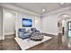 Inviting living room with hardwood floors, stylish seating, and an elegant area rug at 4140 Hillside Nw Pl, Atlanta, GA 30342
