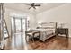 Tranquil main bedroom featuring tray ceilings and a bay window seating area at 4140 Hillside Nw Pl, Atlanta, GA 30342