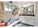 Mud room features a sink with mirror, storage bench, and window at 4140 Hillside Nw Pl, Atlanta, GA 30342