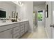 Bright bathroom with dual vanities, tile flooring, and a glass-enclosed shower at 104 Holt Ln, Lawrenceville, GA 30046