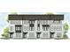 Charming new townhome development with white brick facade and black accents at 104 Holt Ln, Lawrenceville, GA 30046