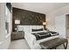 Modern main bedroom with a stylish accent wall, plush carpeting, and natural light at 104 Holt Ln, Lawrenceville, GA 30046