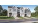 Inviting townhome exteriors with attached garages and well-manicured lawns at 225 Kenoot Dr # 50, Mcdonough, GA 30253
