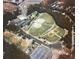 Aerial view of park sports fields, including baseball diamonds, parking, and green spaces at 6935 Melody Ridge Rd, Buford, GA 30518