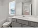 Bathroom features a vanity with drawers, a sink and a view of a tub and shower combo at 6935 Melody Ridge Rd, Buford, GA 30518