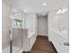 Bathroom features a double vanity, soaking tub, a separate shower, and modern fixtures at 6935 Melody Ridge Rd, Buford, GA 30518