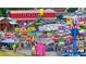 Vibrant and bustling fairground with colorful rides, food stands, and attractions for all ages at 6935 Melody Ridge Rd, Buford, GA 30518