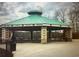 Connie Wiggins pavilion with covered picnic tables, set in a peaceful park setting at 6935 Melody Ridge Rd, Buford, GA 30518