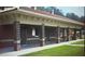 Brick restroom facility offering covered access with picnic tables nearby in a convenient neighborhood location at 6935 Melody Ridge Rd, Buford, GA 30518