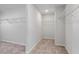 Walk-in closet with ample shelving for optimal storage, providing organization at 6935 Melody Ridge Rd, Buford, GA 30518