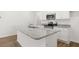 Modern kitchen island with granite countertops, stainless sink and modern appliances at 205 Kenoot Dr # 55, Mcdonough, GA 30253