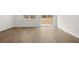 Sunlit living area with sliding glass doors and modern wood-look flooring at 205 Kenoot Dr # 55, Mcdonough, GA 30253