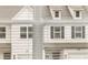 Neighbors houses, viewed through window blinds, offer a glimpse of the surrounding community at 205 Kenoot Dr # 55, Mcdonough, GA 30253