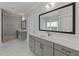 Bathroom with double vanities, white countertops, and modern fixtures, offering style and functionality at 357 Mell Ne Ave, Atlanta, GA 30307