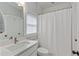 Clean and bright bathroom featuring a white vanity and a shower with a white curtain at 357 Mell Ne Ave, Atlanta, GA 30307