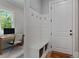 Entryway features built-in bench with storage, coat hooks and a convenient workspace at 357 Mell Ne Ave, Atlanta, GA 30307