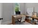 Bright and comfortable home office featuring a modern desk, chair, and built-in bookshelves at 357 Mell Ne Ave, Atlanta, GA 30307